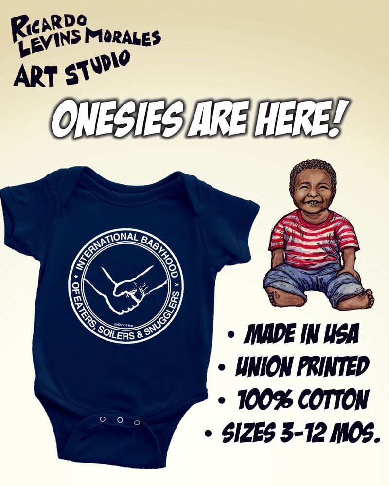 Yellow background. On top left of image, text reads "Ricardo Levins Morales Art Studio". 
Below this, centered text reads "Onesies are here!'. 
Below this, to the left, a blue onesie. To the right of this, a child wearing a red and white striped shirt and blue jeans.
Below this, text reads "Made in USA, Union printed, 100% cotton, sizes 3-12 mos".