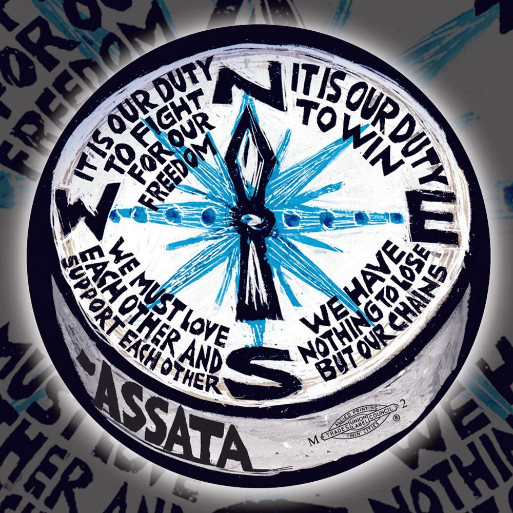 Design features a compass with blue lines extending from the center. 
“It is our duty to fight for our freedom. It Is our duty to win. We must love each other and support each other. We have nothing to lose but our chains.”

This pin button design comes from the compass on Ricardo’s poster “It Is Our Duty to Win”, featuring these words from Black revolutionary Assata Shakur pointing the way to the “north star” of freedom. Written from a prison cell in 1973, the quote has since become a rallying cry for the movements for Black lives and total liberation.