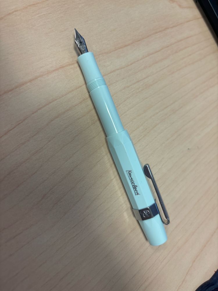 Kaweco Sport fountain pen with metal clip accessory.