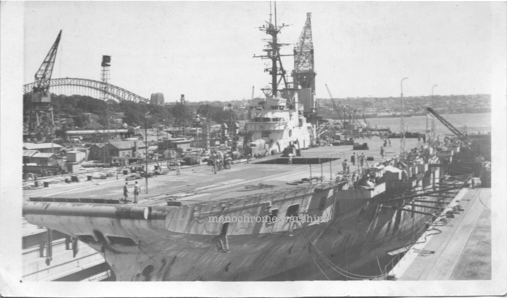 Colossus-class carrier HMS Vengeance in Captain Cook Engraving Dock, Sydney, Oz. Sydney Harbour Bridge can be seen in the background.