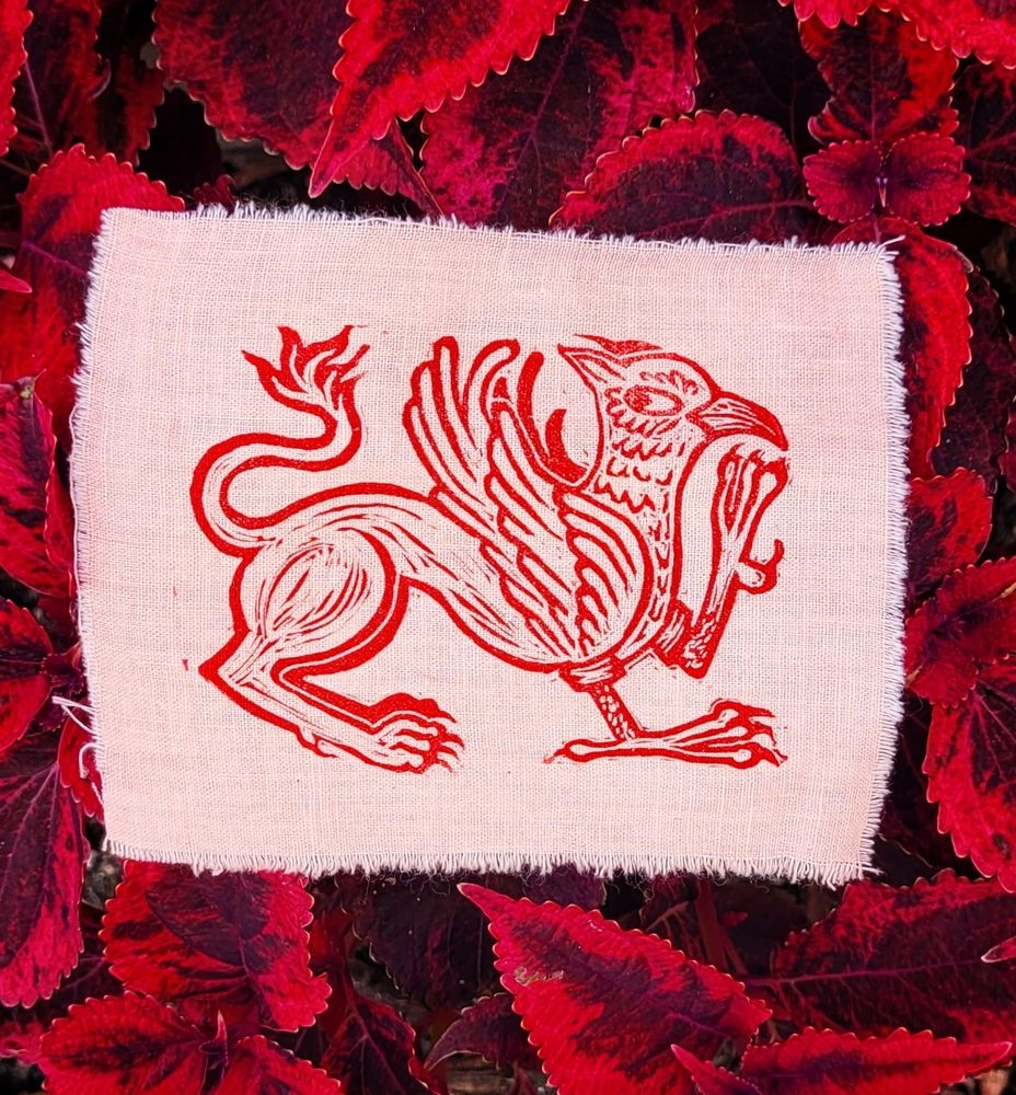 Red gryphon block print on light salmon cotton