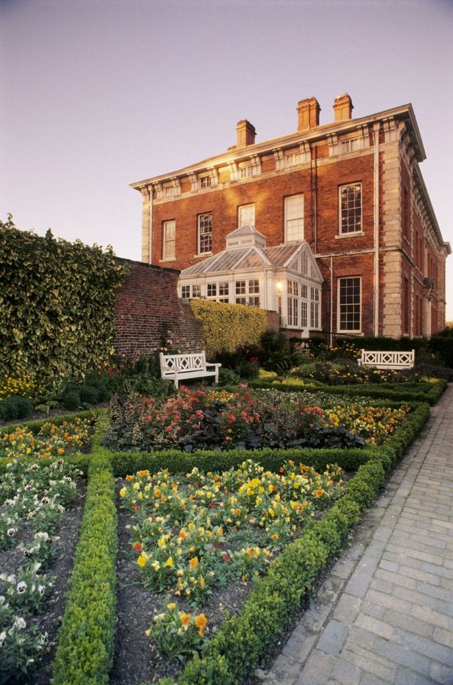 A large country house and formal garden 