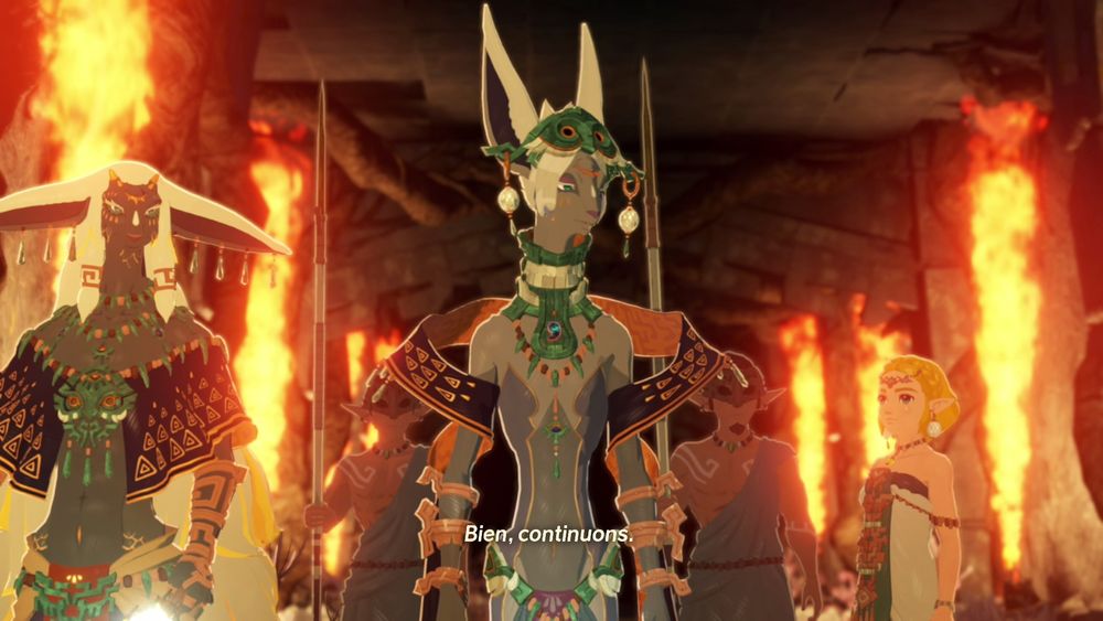 Mineru entourée de Rauru et Zelda qui sont tous les 3 éclairés par des flammes gigantesques.