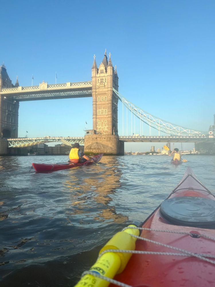 Tower bridge is in sunset light, I’m in a red kayak just in front of it