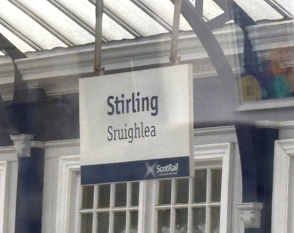 A railway station sign that reads Stirling/Sruighlea