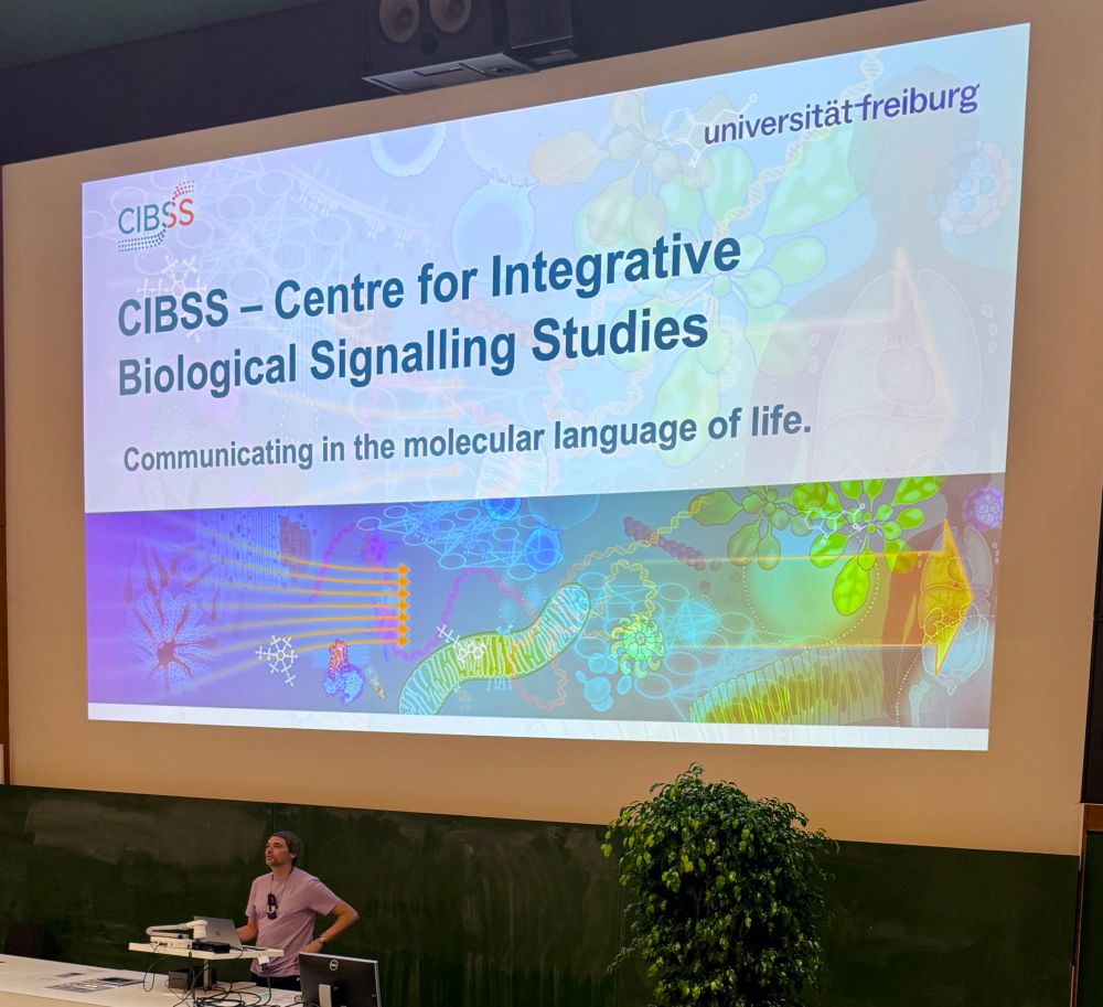 A photo of Prof. Dr. Jürgen Kleine-Vehn showing the Titleslide of his presentation