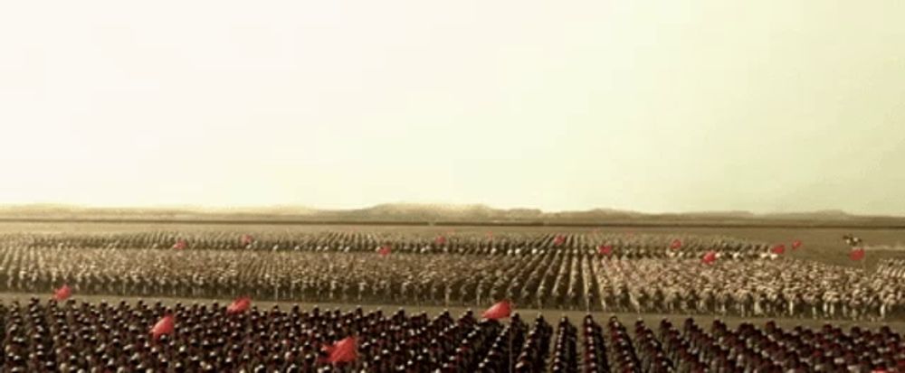 a large group of soldiers marching in a field