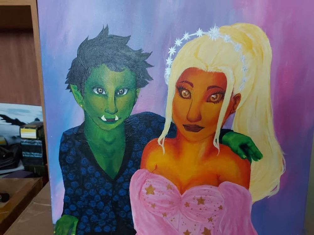A wedding portrait of a goblin man and fire genasi woman 
He is wearing a dark navy blue fancy suit jacket with a slightly lighter floral pattern on it 

Still one of my favourite paintings I've ever done ♡♡♡