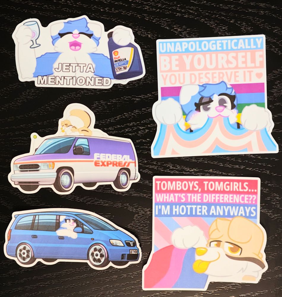 large laminated stickers of Jetta, and Desi, her tan dog boyfriend, with two including two different vans