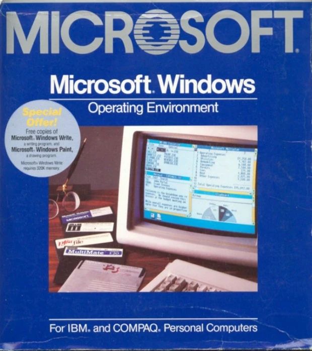 Vintage packaging of Microsoft Windows Operating Environment, showcasing a CRT monitor displaying the early Windows graphical interface with windows and a pie chart, surrounded by floppy disks and office items. The box highlights compatibility with IBM and COMPAQ PCs and includes a special offer for Microsoft Write and Paint.