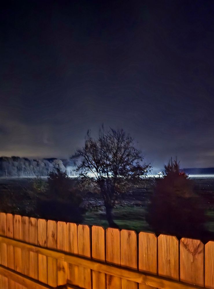 Aliens landing in a field