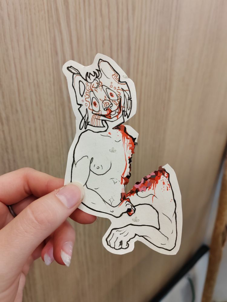 Gore art shows autor's avatar (the strange anthro cat with a lot of patterns) is сutting himself on two pieces while creepy smiling