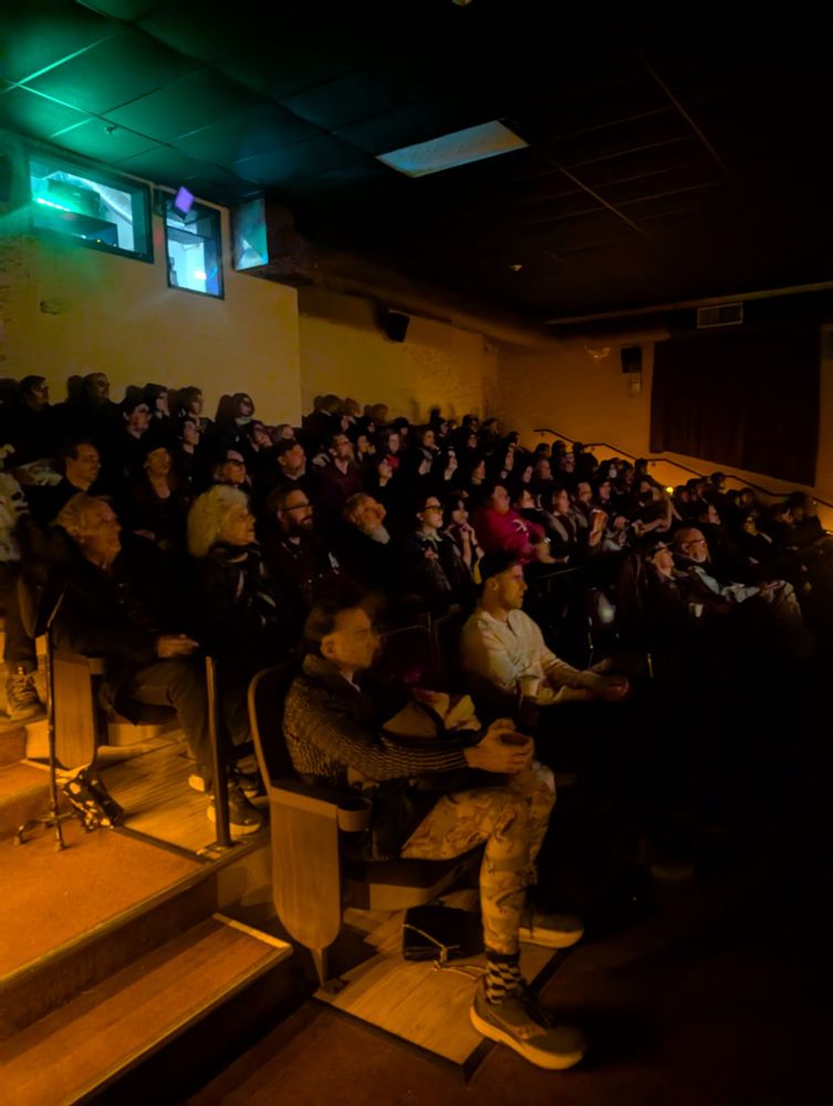 Packed movie theatre with patrons watching the screen at Cinemopolis in Ithaca NY