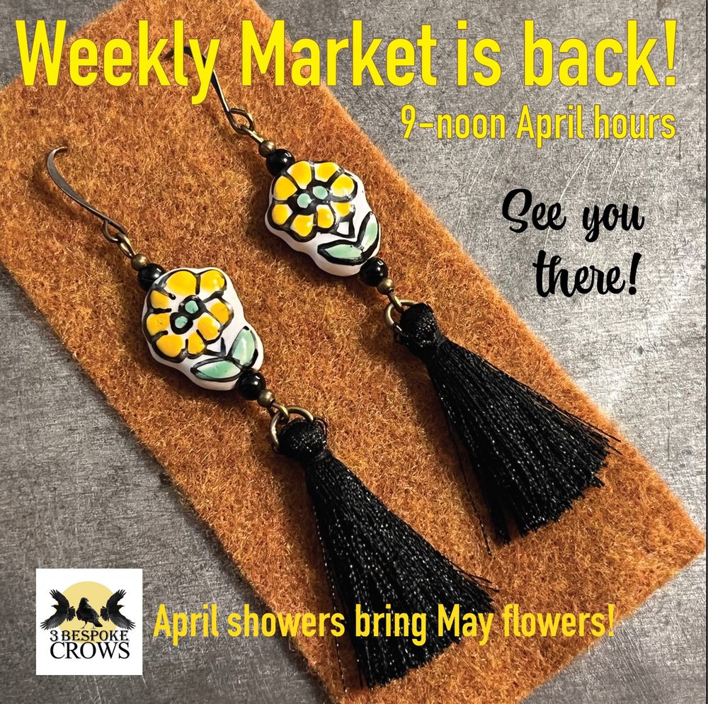 Pictured here are antiqued bronze earrings with ceramic beads that have whimsical sunny yellow flowers and green leaves drawn on. Below are dangling silky black tassels that match the flower outlines. 