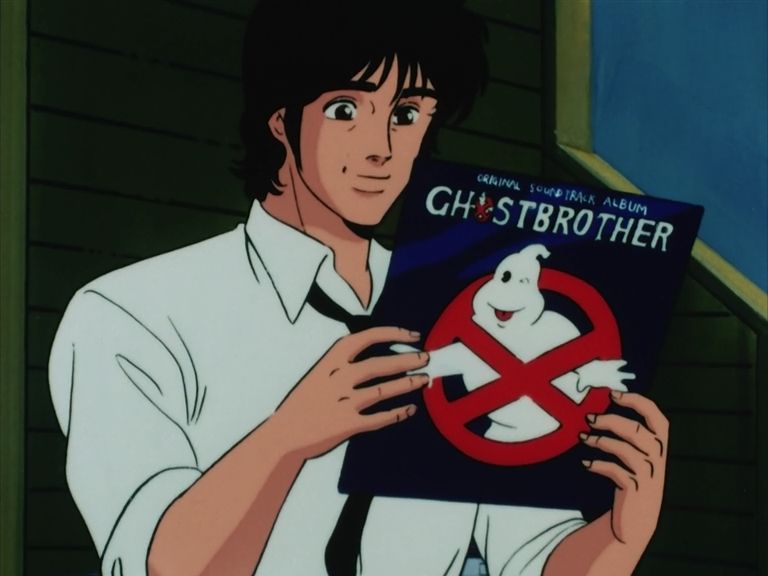 A screenshot from Cat's Eye, season 2, episode 6. Toshi holding a vinyl record of Ghostbrother, an obvious Ghostbusters spoof.