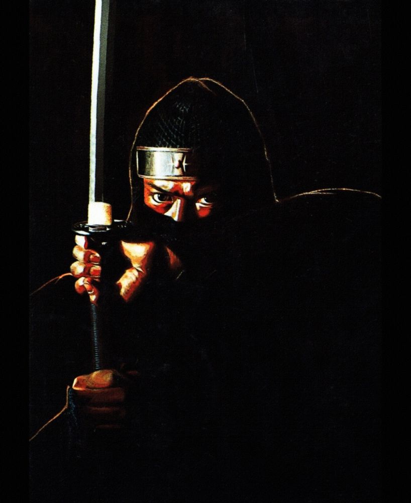 The Super Shinobi clean artwork (The Revenge of Shinobi in the west) used on the cover of the Japanese Sega Mega Drive release. Image depicts a ninja holding a katana while looking menacingly with a dark background. His eyes are heavily borrowed from the likeness of Sonny Chiba and where changed in the later versions of the game to avoid any rights infringement.
