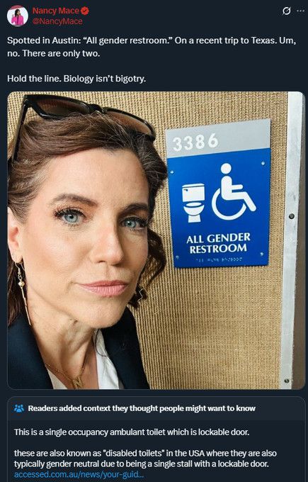 nancy mace in front of an "all gender restroom" sign with the caption "um, no. there are only two.  hold the line. biology isn't bigotry"