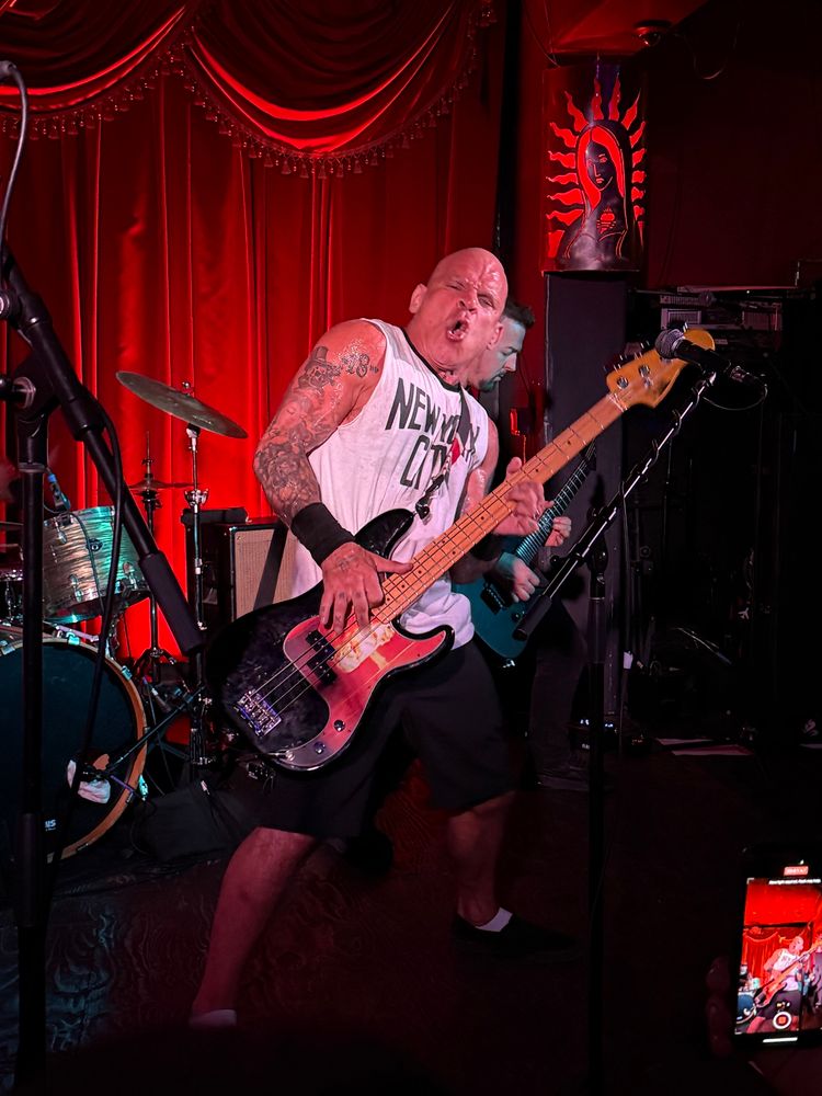 Harley Flanagan Cro-Mags playing at Alex’s bar. He is wearing his New York City shirt has a black base with the age of quarrel explosion on it.