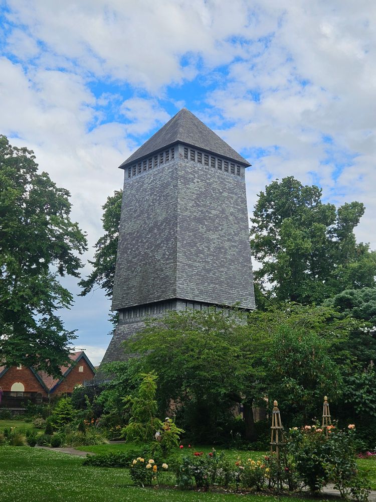 View of Addleshaw Bell Tower (topped with blue / grey slate from north Wales). View of Chester Cathedral Memorial garden 