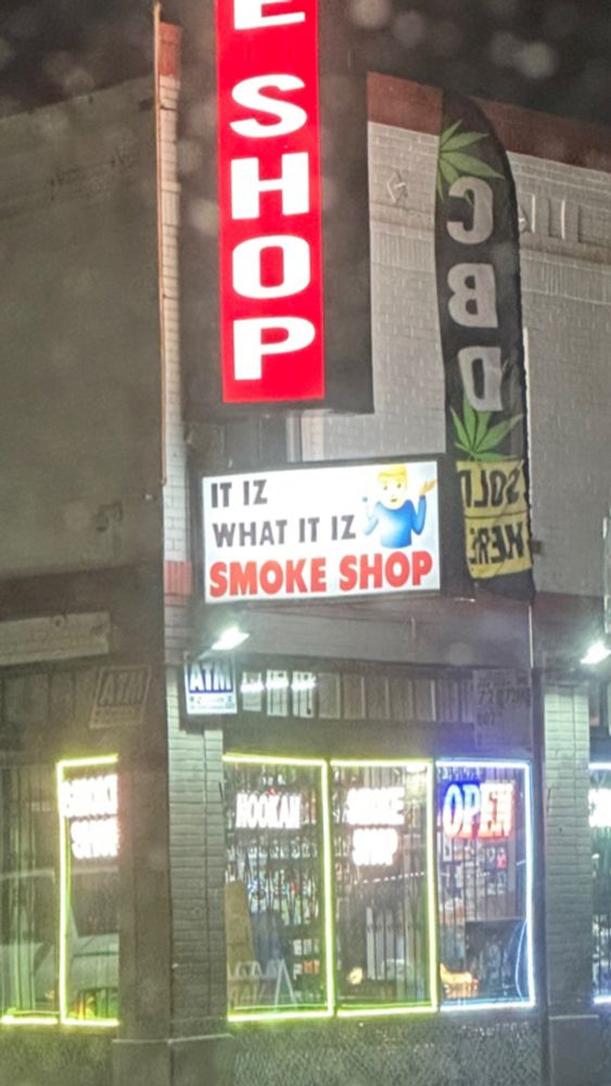 head shop with a sign that says it is what it iz 🤷‍♂️