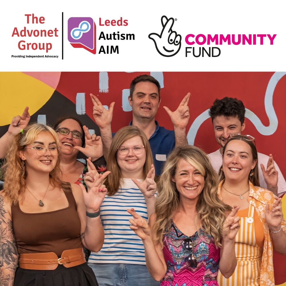 An image with the Advonet Group, Leeds Autism AIM and National Lottery Community Fund logos at the top, with a photo of members of our staff team doing the 'fingers crossed' sign with their hands below.