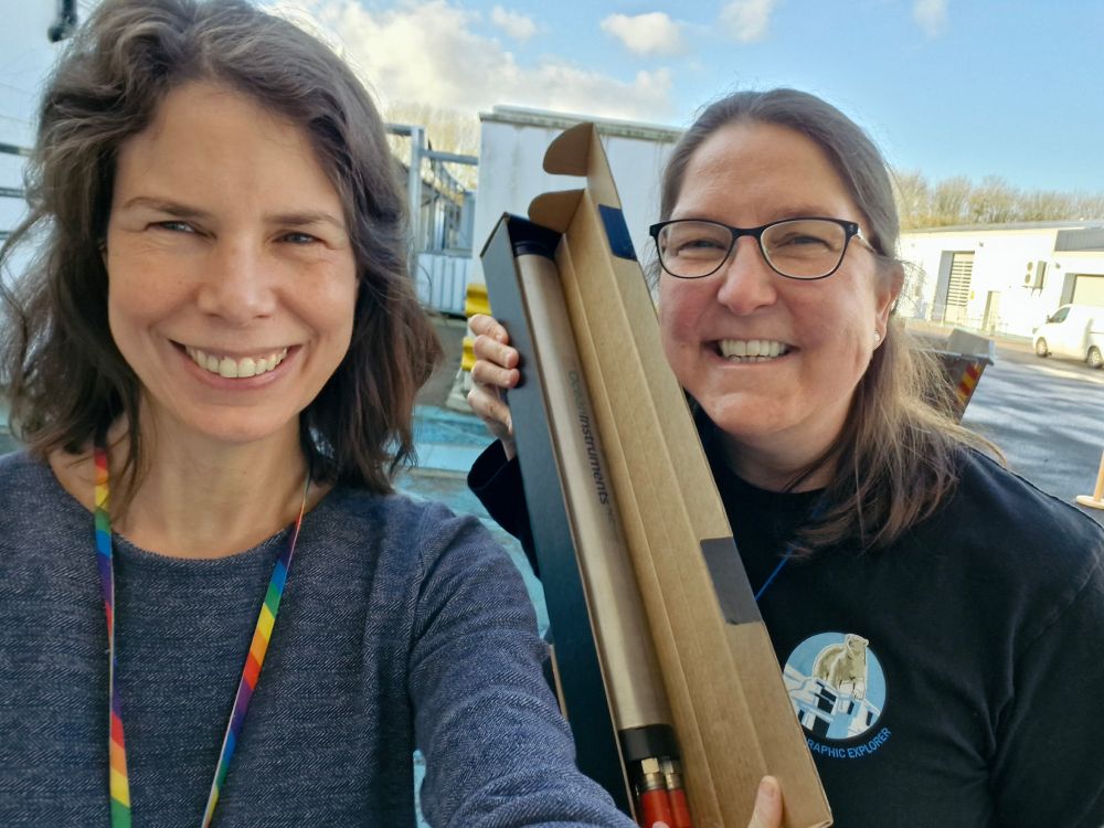 Jen Jackson and Project Manager Steph Martin holding up a Soundtrap in a cardboard box