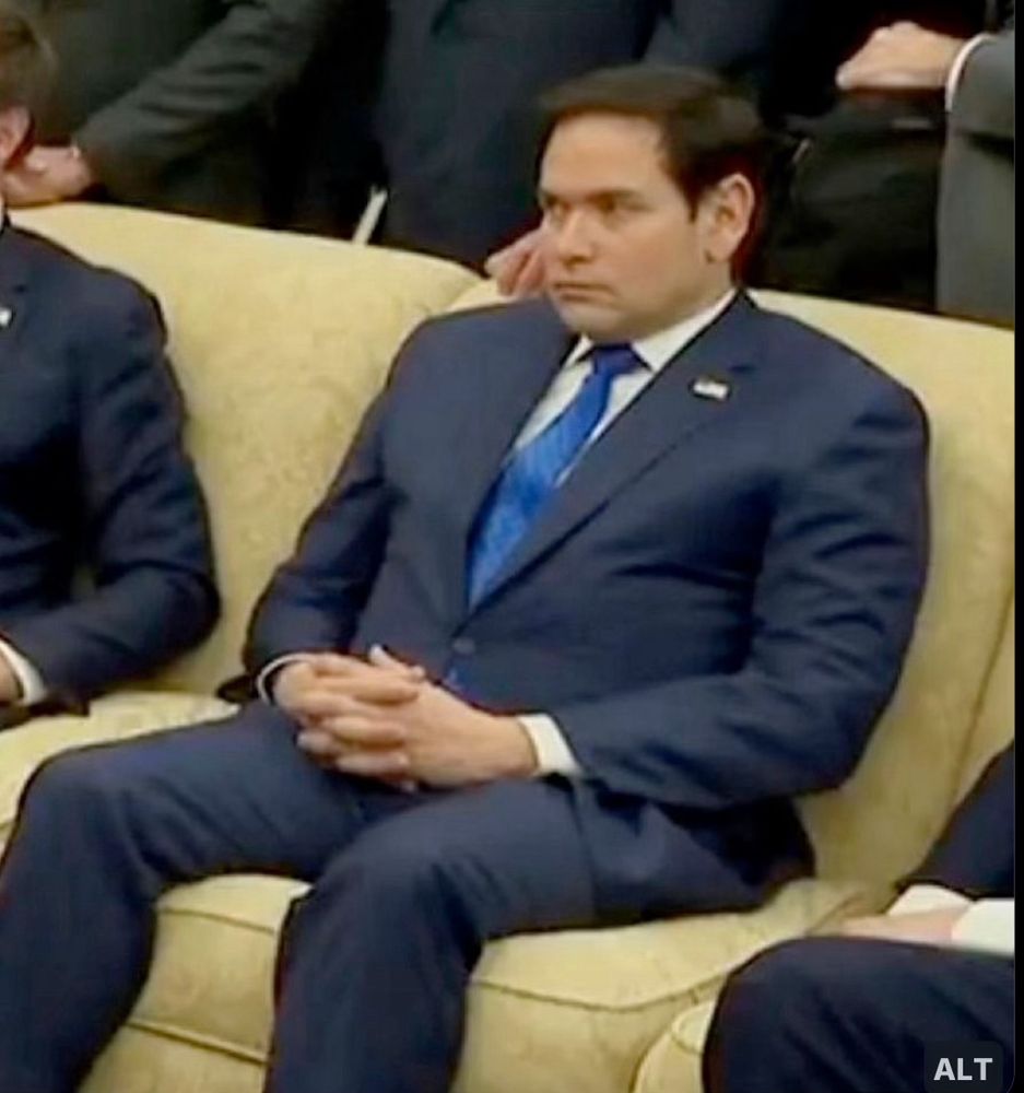 Marco Rubio trying to disappear into the couch in the Oval Office