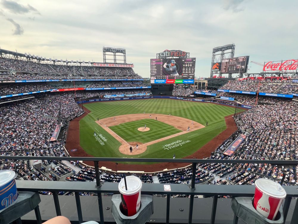 A view of Citi Field from the 300-level stands behind and above home plate. The Mets are bearing the giants 8-6 in the bottom of the 6th inning.