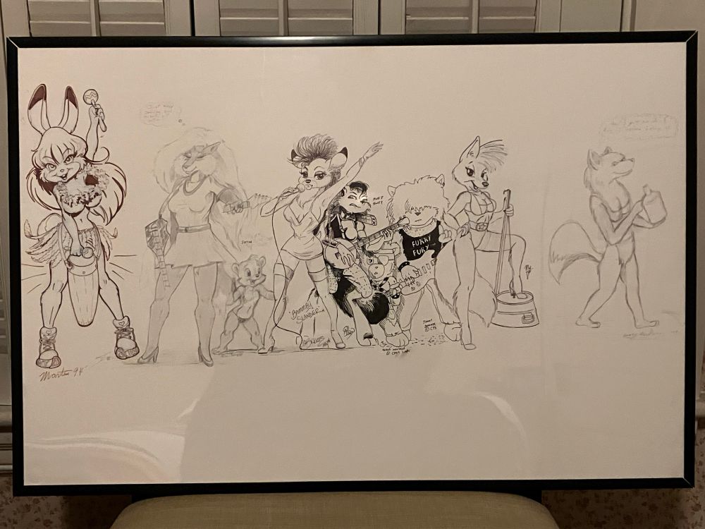 A photo of a large piece of monochromatic artwork. This was drawn by multiple artists at FurTastiCon in 1994 with a music making theme. Some of the contributing artists here are Steve Martin, Chris Sutor, and Joseph Ny. Some drawings are done in black ink while others are in pencil.