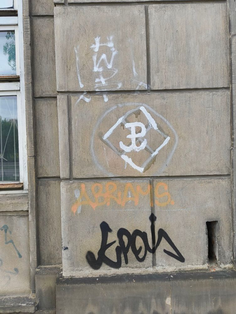 Socrealist block on ul. Radzymińska, Warsaw. Swastika vandalism covered up with a 'kotwica' symbol by some upstanding citizen