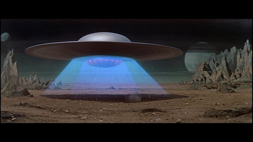 Saucer-shaped United Planets cruiser C-57D landing on the planet Altair IV in the movie Forbidden Planet.