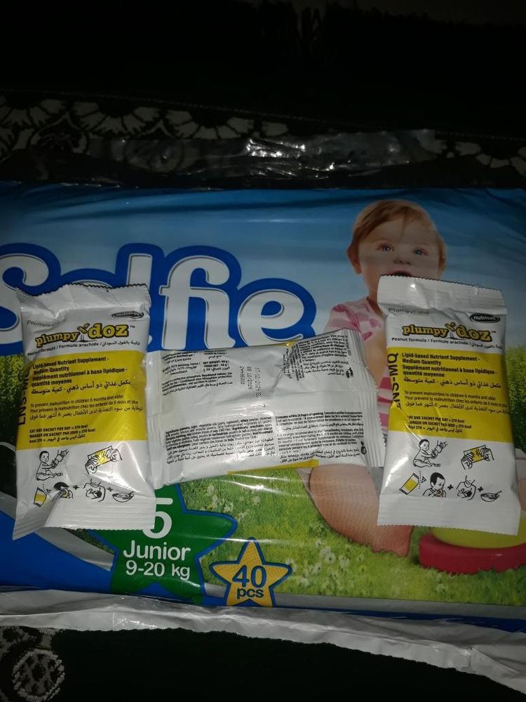 photo taken by my friend Abod, at night, under a flashlight. a few packets of a peanut flavored nutritional supplement for his baby.