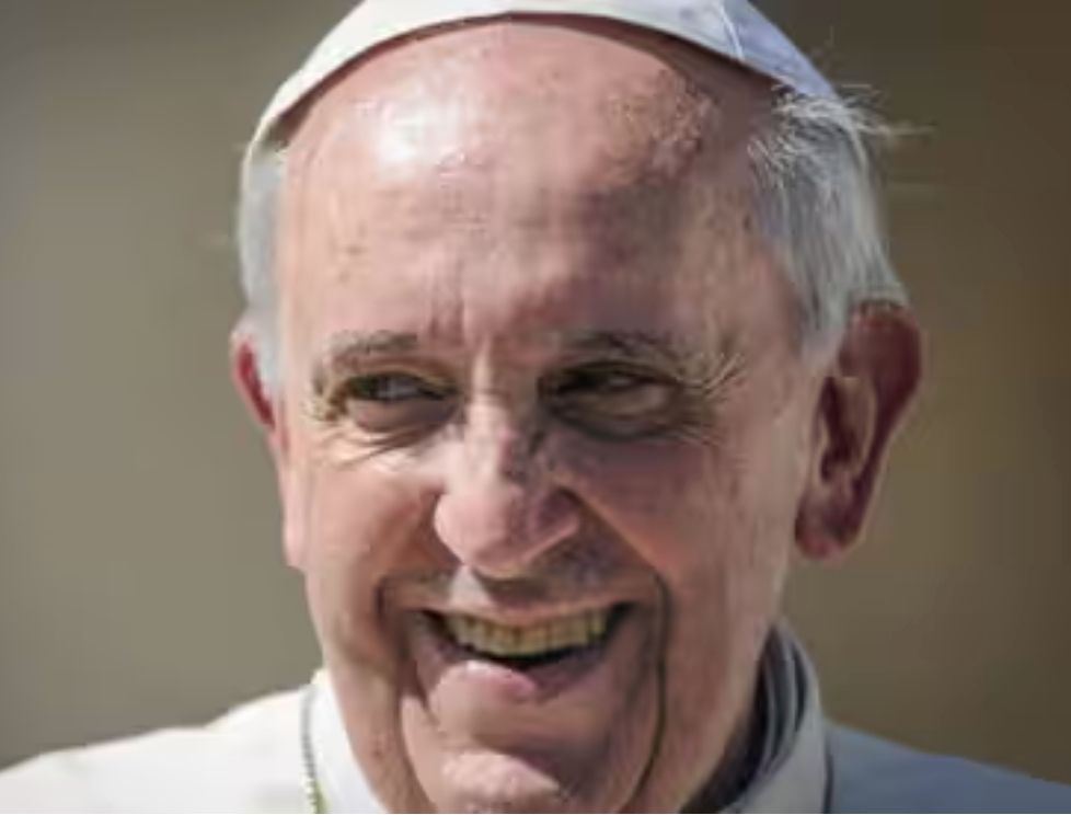 Photo of Pope Francis smiling.