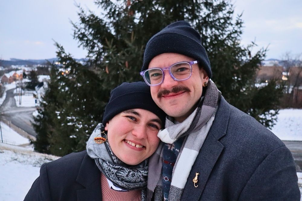 Me and my husband standing and hugging out in the snow