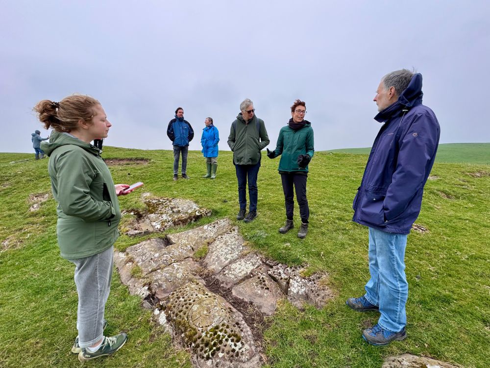 Participants discussing the rock art at High Banks, Kirkcudbright © ScARF