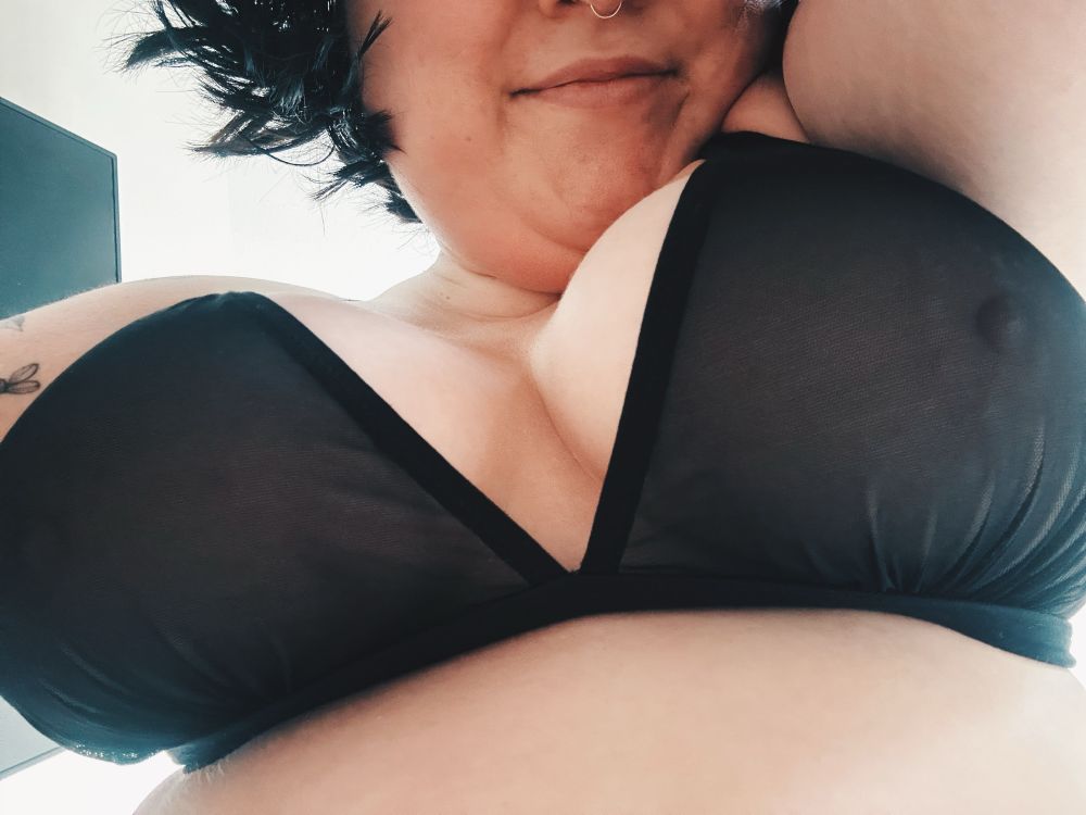 seline from mid face to just below her breasts. she’s wearing a black mesh bra and you can see her hard pink nipples begging to be touched. she’s hovering over the camera and smiling down. the perfect position to enjoy as many handfuls and mouthfuls as you desire. 