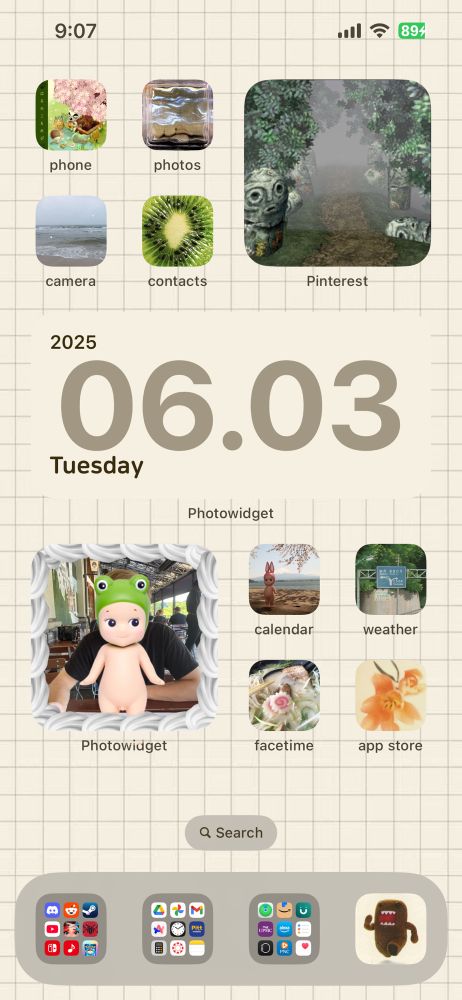 a mostly beige apple home screen with apps in groups of 4, separated by widgets. 4 apps, small pinterest widget, medium date widget, small photo widget, 4 apps. the apps have color themed icons fitting a “juminocore” aesthetic, mostly green, beige and blue with some being warmer colors.