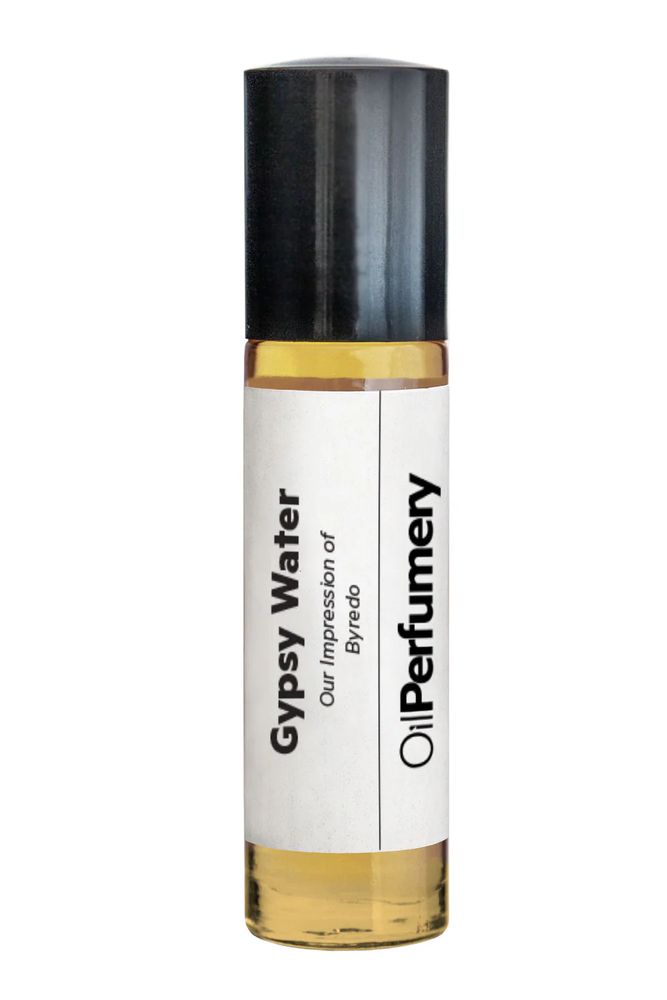 A cylindrical rollerball perfume oil bottle with a black cap. The label reads "Gypsy Water", "Our Impression of Byredo", Oil Perfumery".