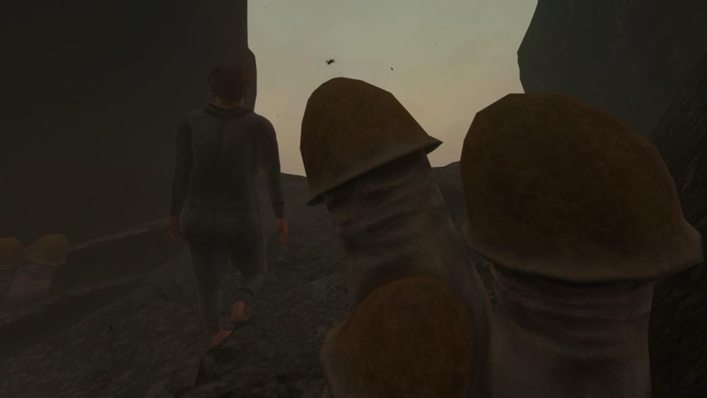 A screenshot of Baby Steps.

Towards the left of the frame protagonist Nate is standing under an arch on the mountain. 

To the right of the frame, in the close foreground, are some large and extremely phallic-looking mushrooms, with pink skin tone shafts and big red tops.