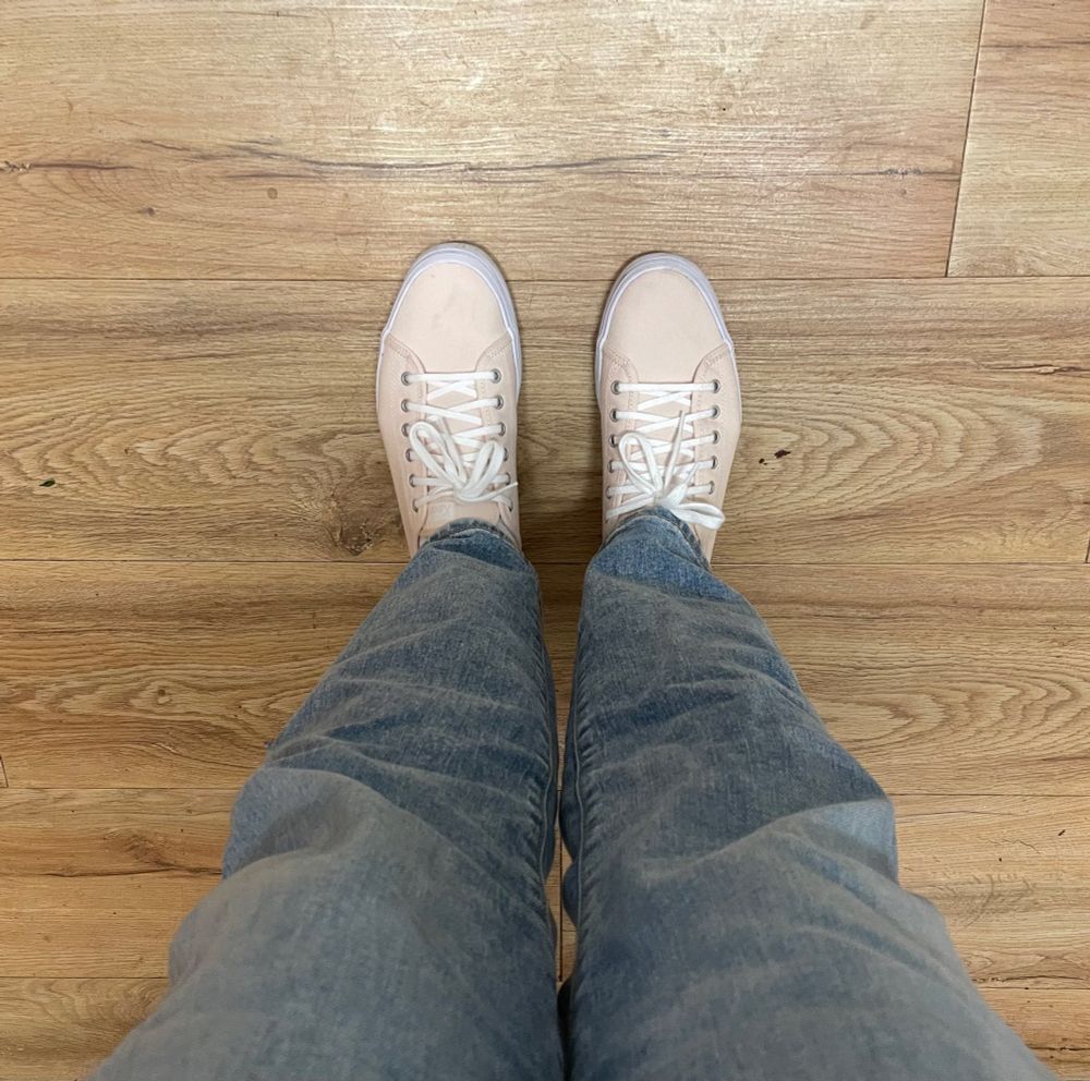 my legs from above, I’m wearing jeans and keds 