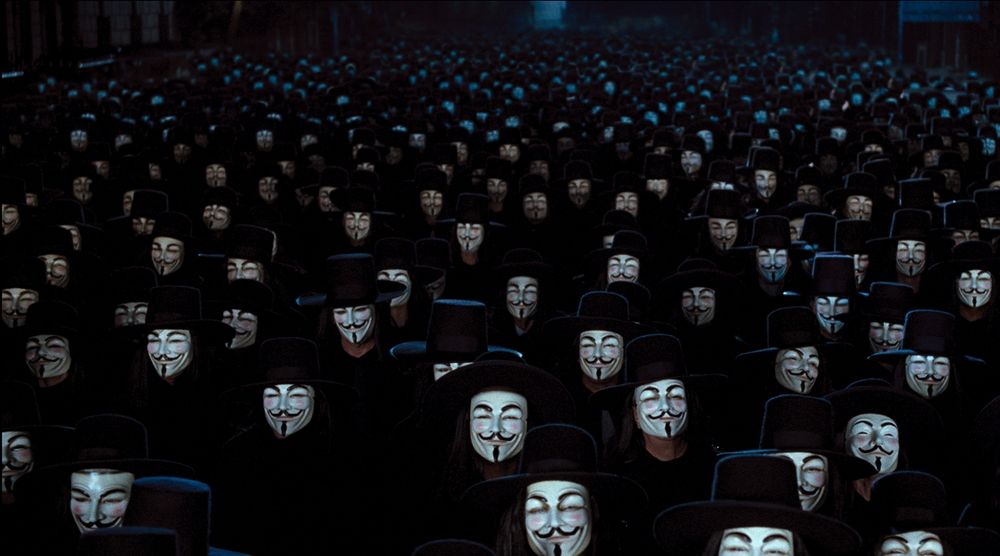 image shown from the movie v for vendetta. everyone in the crowd is wearing the exact same mask making it impossible to differentiate the good and the bad. it's protection for good.