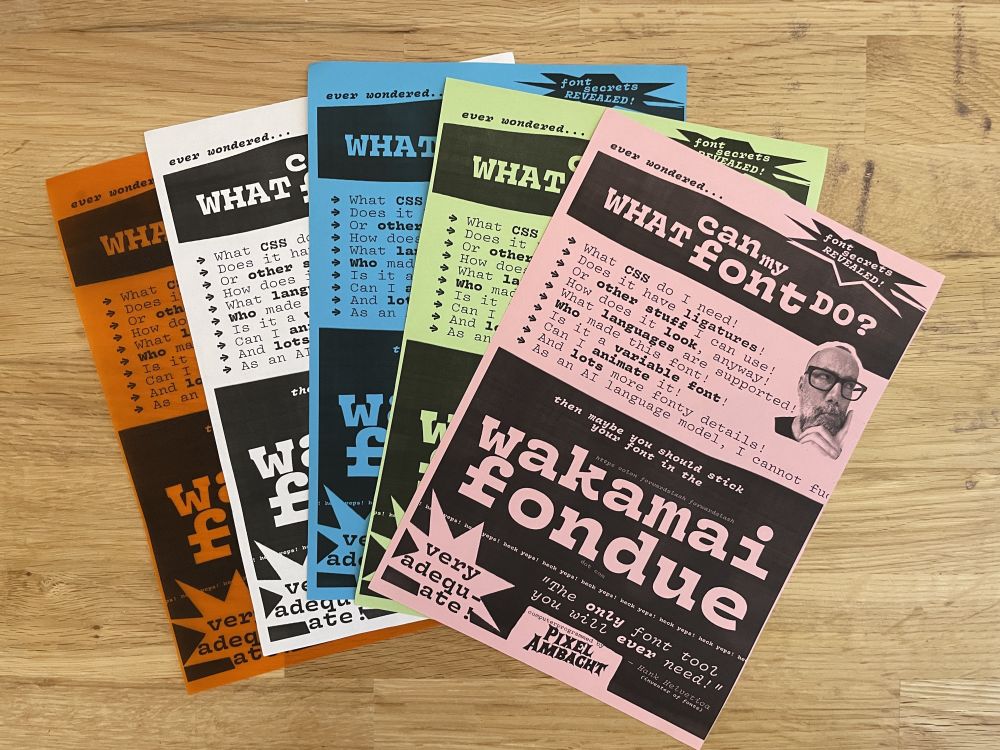 Five colorful and horribly designed flyers for Wakamai Fondue on a wooden table