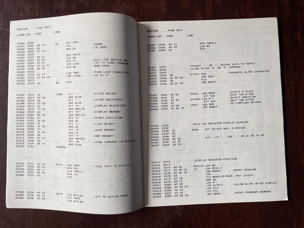 The inside of the manual, showing complex machine language source code with comments
