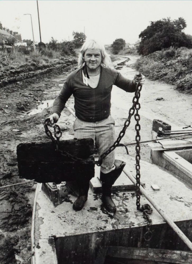Bill Thorpe holding a big plug attached to a chain