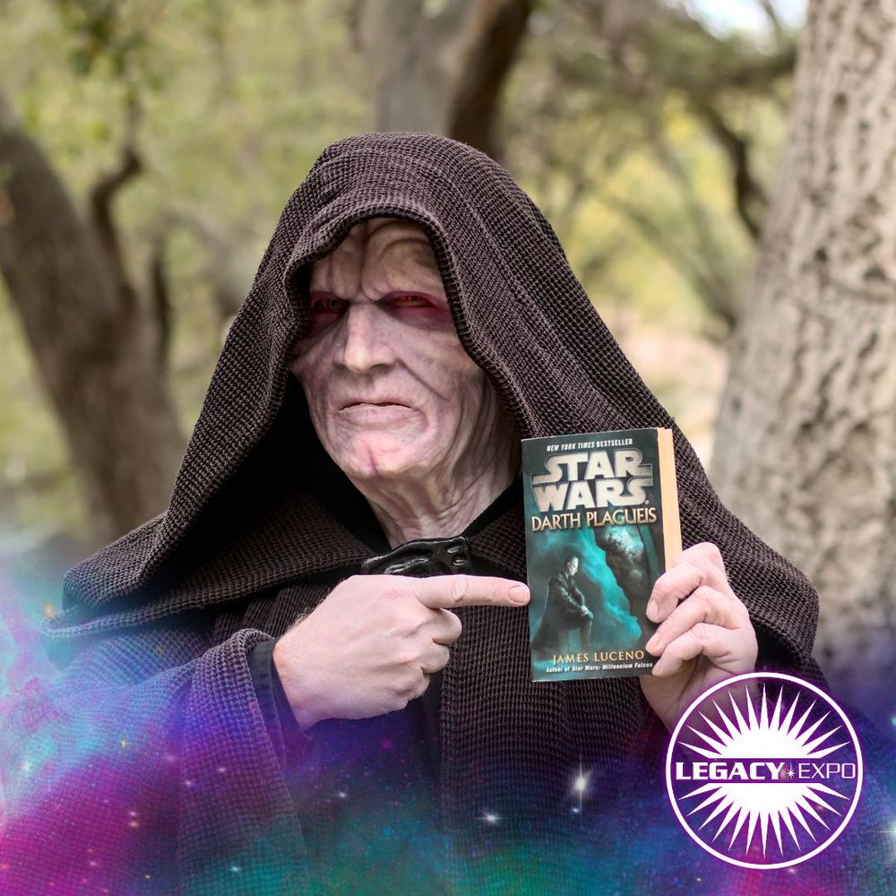 An Emperor Palpatine copslayer holds up and points to a copy of James Luceno's novel, "Darth Plagueis"