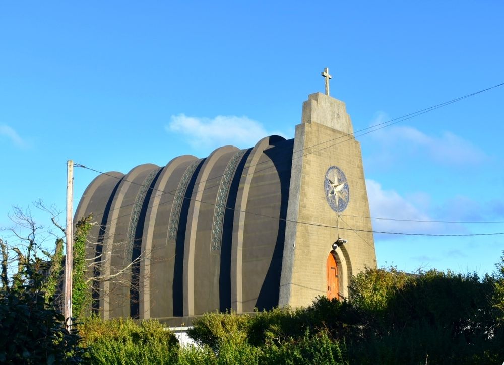 Our Lady Star of the Sea and St Winefride (Welsh: Mair, Seren Y Mor a Santes Wenfrewi) is a Roman Catholic church in Amlwch, Anglesey. It was built in the 1930s to a design by an Italian architect, Giuseppe Rinvolucri, using reinforced concrete. The church is loosely in the shape of an upturned boat, possibly reflecting Amlwch's maritime heritage. The glass inserts over the roof provide internal illumination