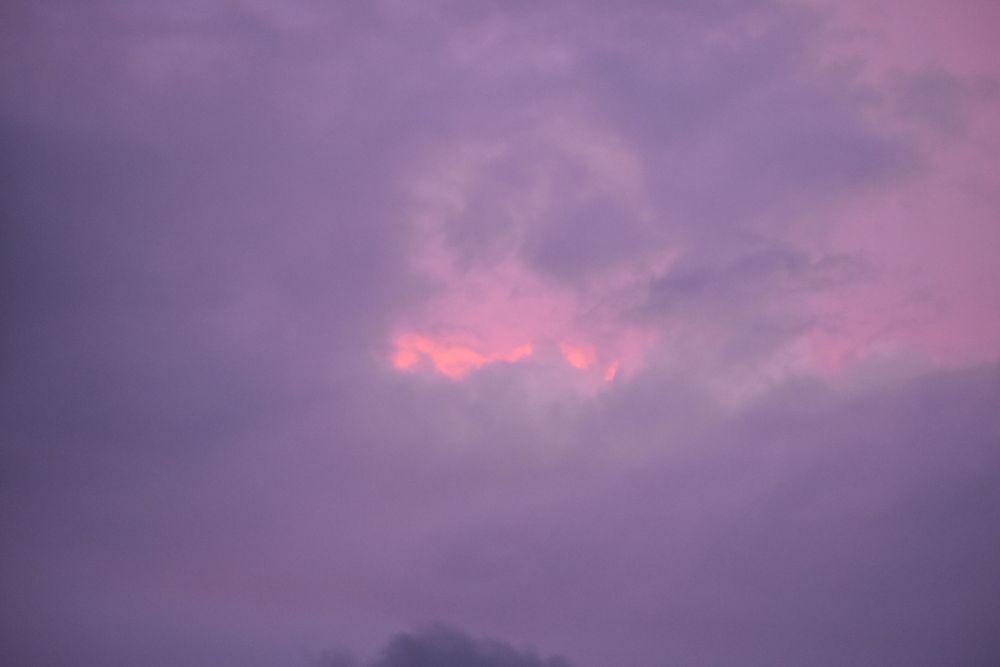 Dramatic purple and pink clouds at sunset