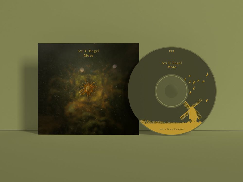 cd cover of Avi C. Engel's new album "Mote" featuring a celestial/aquatic nebula-like creature on a dark background. Also featured is the disc itself, with Fenny Compton's trademark windmill & birds