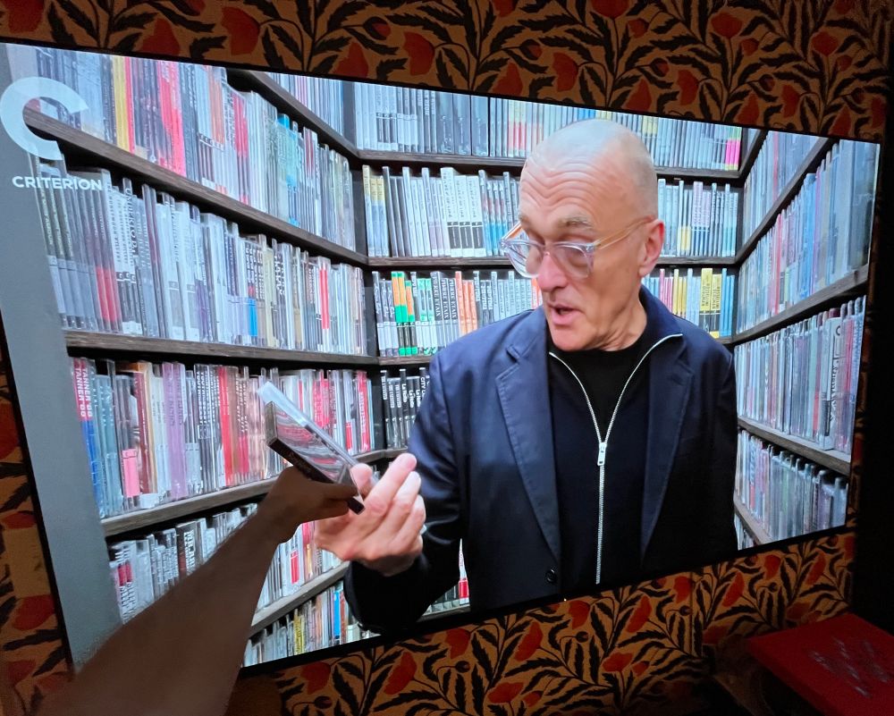 Further shot, holding a blu-ray up to screen, criterion closet discs are same size