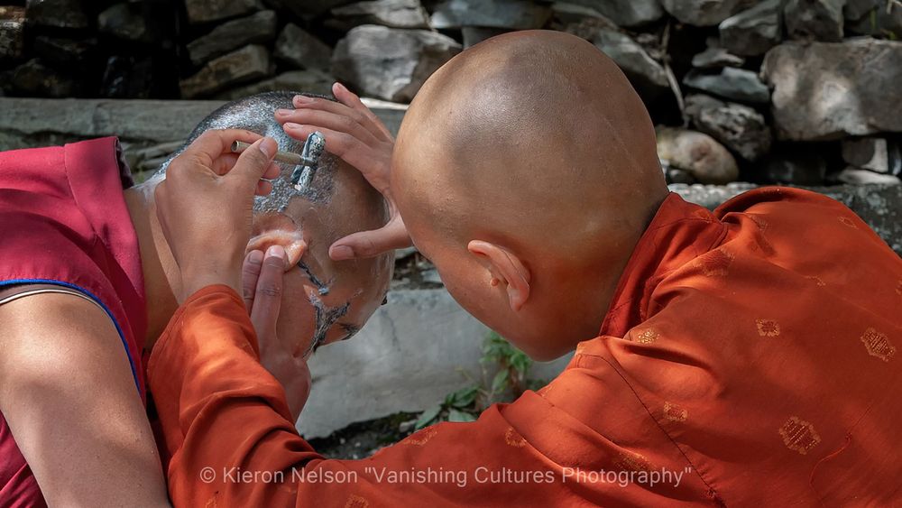 A nun in Ladakh is getting her head shaved.